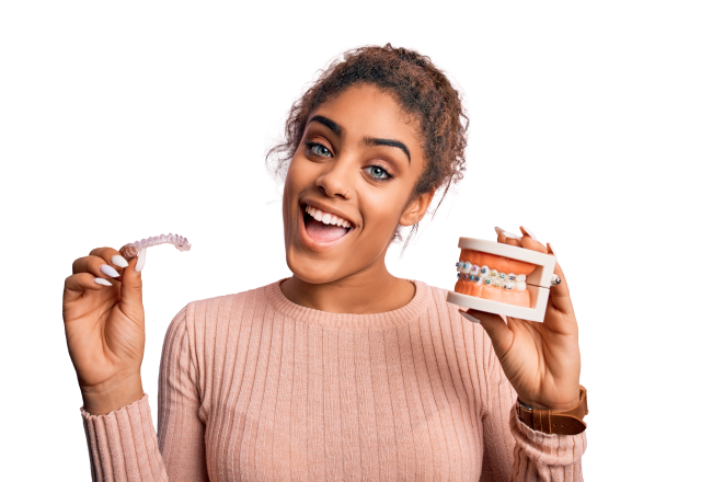 A smiling woman holding invisible and traditional braces.